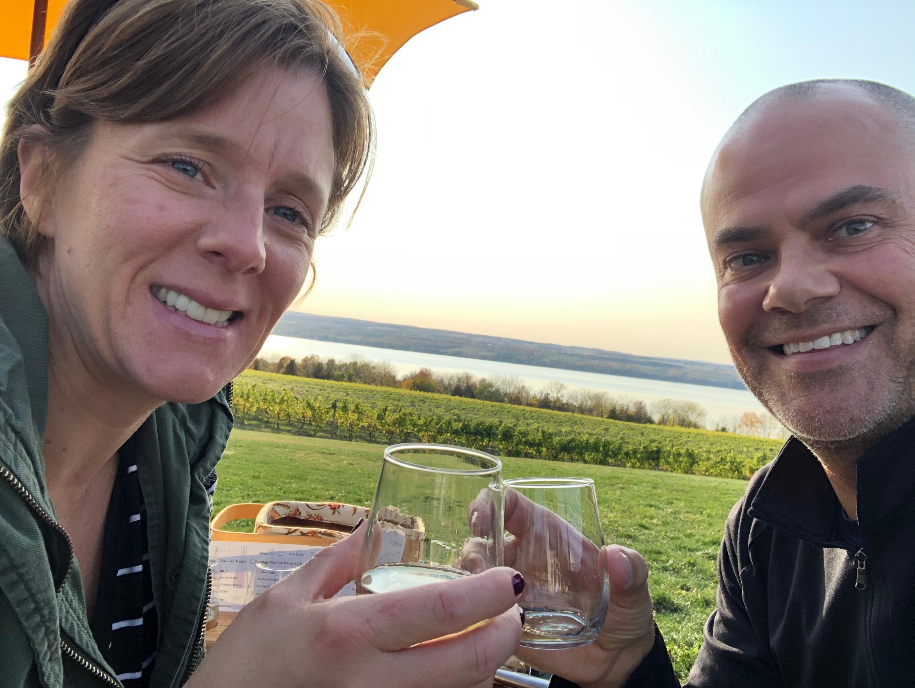 Bill and Kristy Darcy toasting wine glasses at BBRX